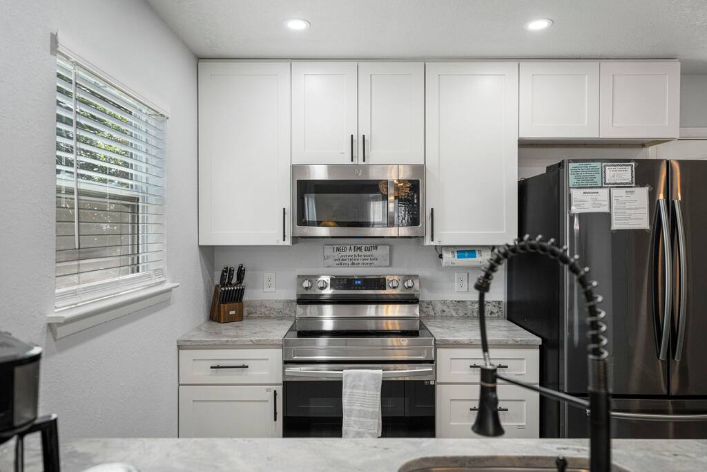 Updated kitchen with stainless appliances. Well stocked with a variety of cooking essentials.