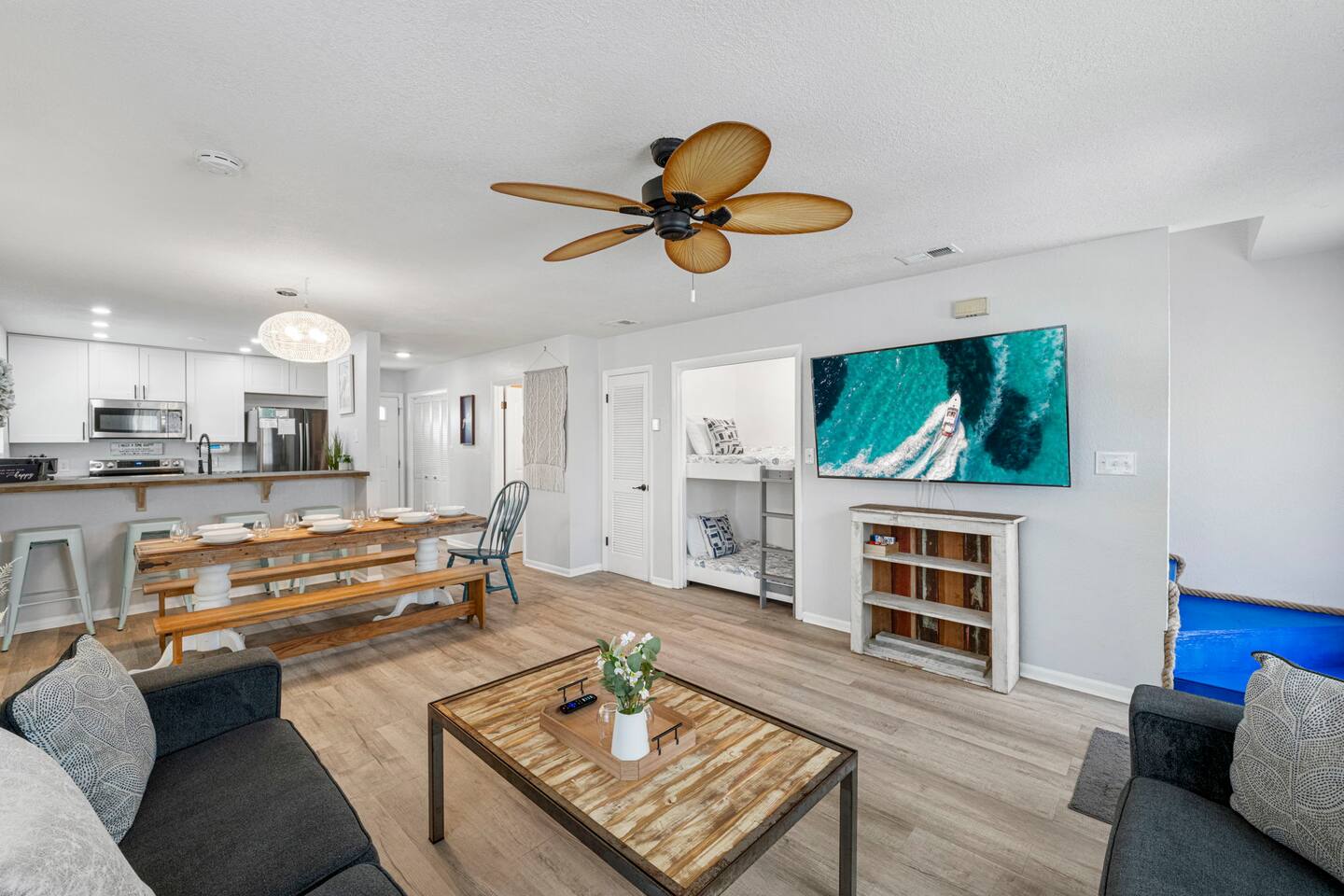 Open living room with two bunk beds. Perfect for children to have their own space 5 min to Beach. Free golf cart. Fenced backyard