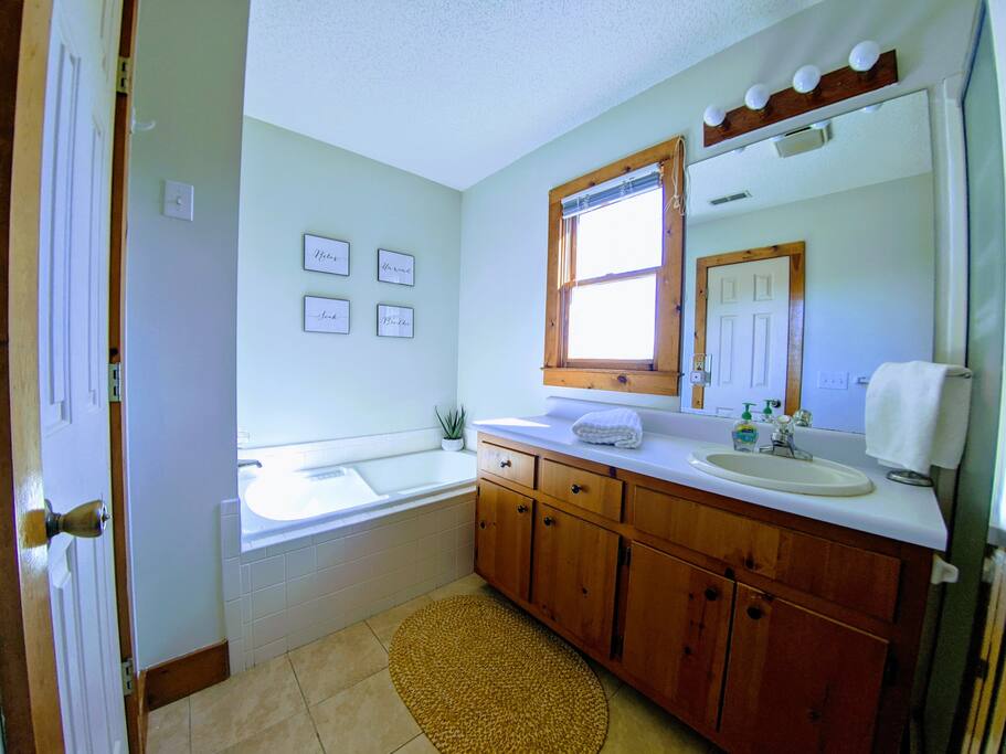 The spacious master bathroom features a deep jetted tub as well as a separate shower. We also provide plenty of soft and luxurious linens for the bathrooms. - Mountain View at Clayton - Clayton