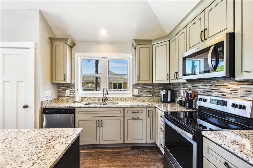 An off-white themed kitchen that blends elegance and culinary creativity seamlessly.