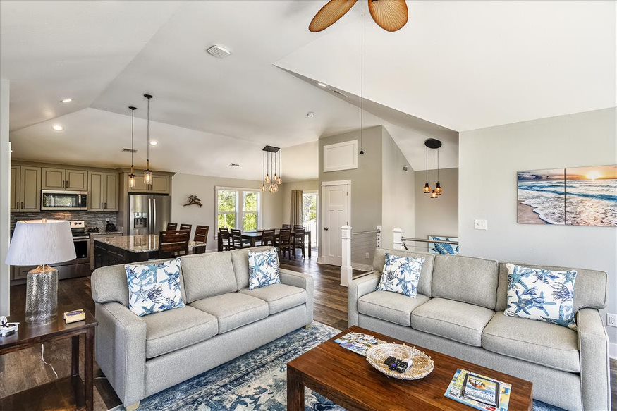 White Harmony: A Living Room and Kitchen Unite in Serene Elegance.