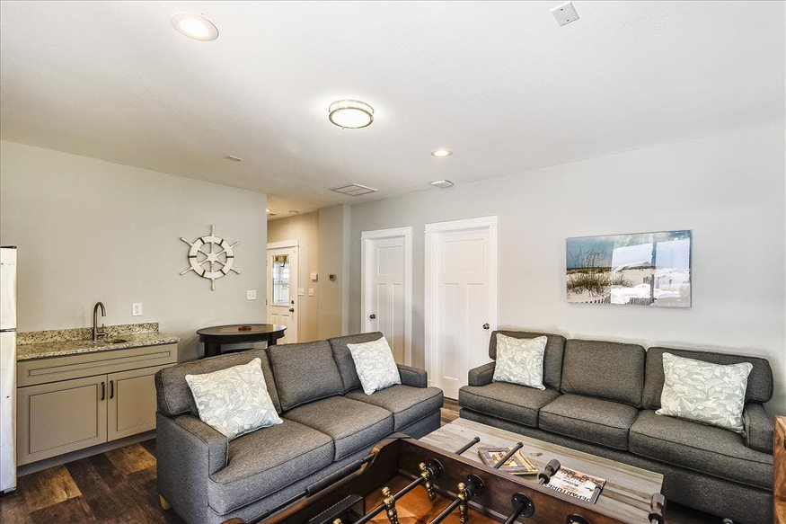 Sea Breeze Comfort - Grey Sofas, Coffee Table, and a Coastal Living Room