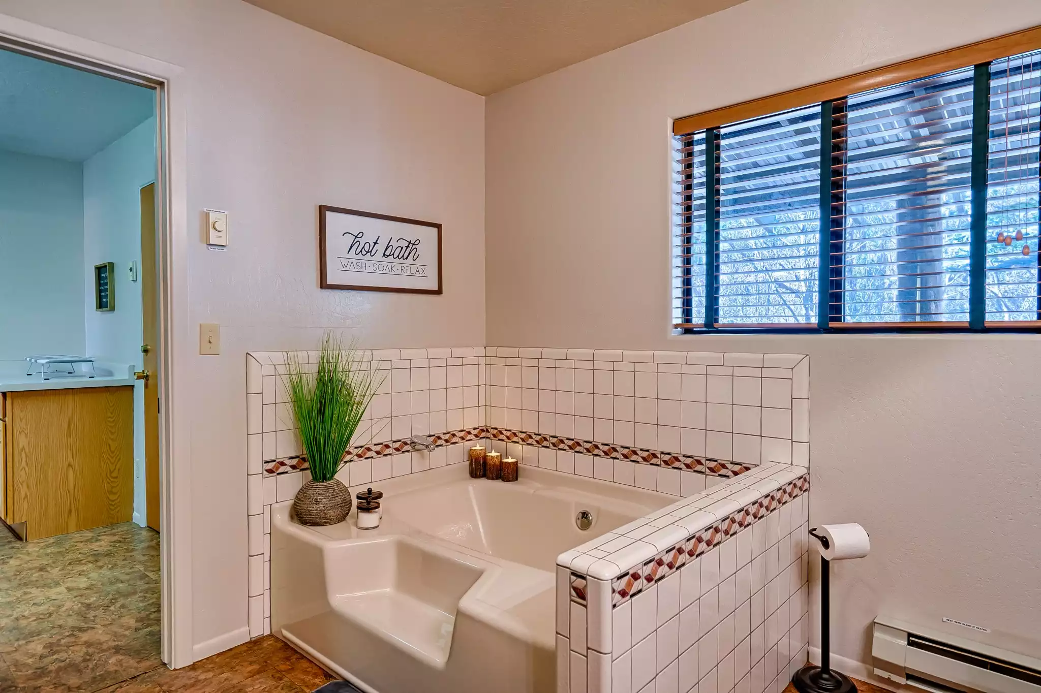 Downstairs primary bath with amazing garden tub!  - Greer River's Edge Cabin  - Greer