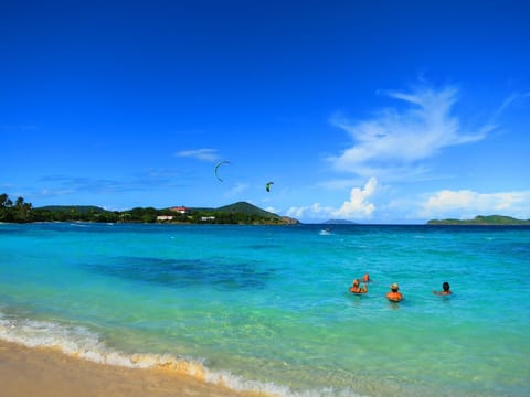 Enjoy a drink in the turquoise water of the Sapphire Beach