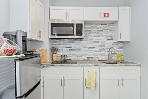 This is the kitchen. The countertops have a really cool leather-feeling finish.