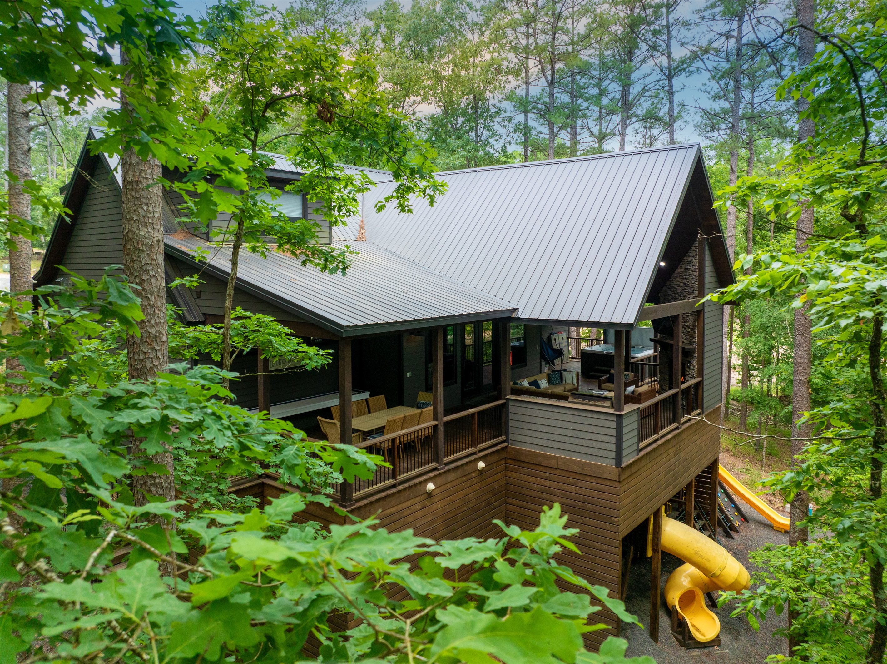 Enjoy the 1,200 sq foot covered deck while the kids play below.