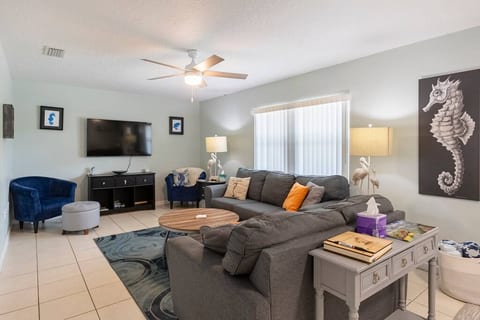 The living room has plenty of comfortable space to relax.