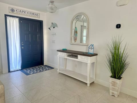 Our entryway is open and welcoming, setting the tone for your stay. You'll find the Wi-Fi name and password right on the table, ensuring you stay connected with ease from the moment you arrive.