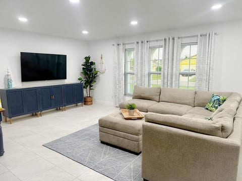 Sink into our roomy sectional and indulge in your favorite programs on the 65" Roku TV. It's the perfect way to enjoy some quality time together and create lasting memories with family and friends!