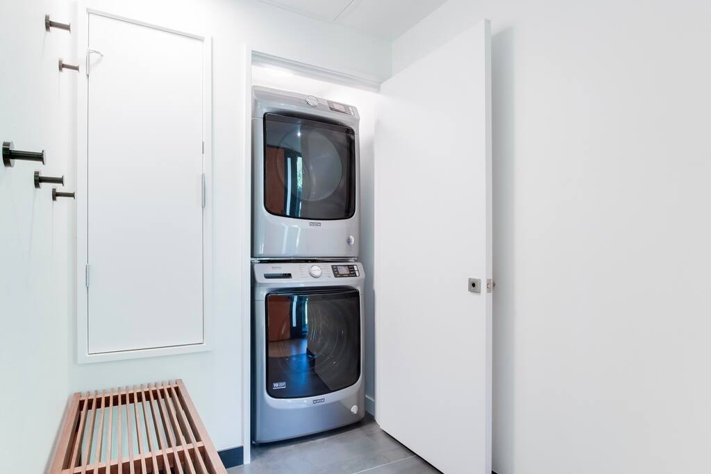 Full size washer and dryer. lots of room for jackets boots and snow gear. 