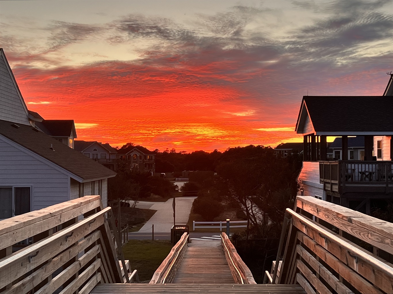 Capturing the magic of dusk, the sky transforms into a canvas of orange and gold during a stunning sunset.