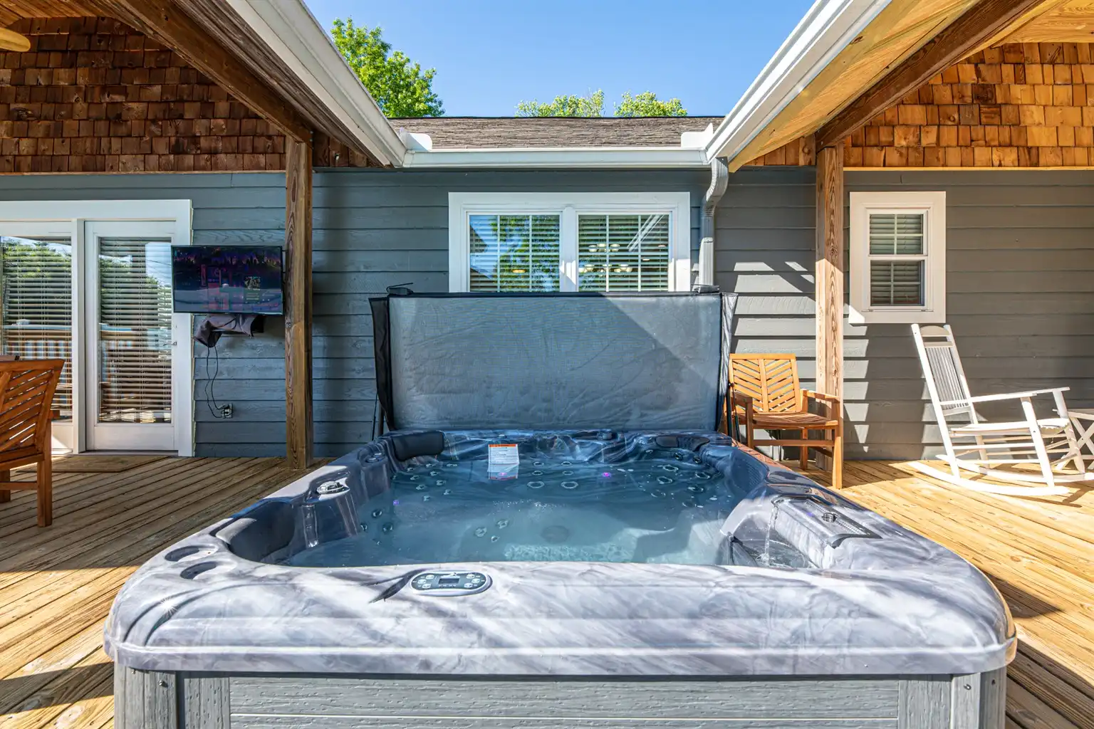 Enjoy a relaxing dip in the hot tub, with full view of the outdoor television! Enjoy a relaxing dip in the hot tub, with full view of the outdoor television! - Ballin' Backyard - Knoxville
