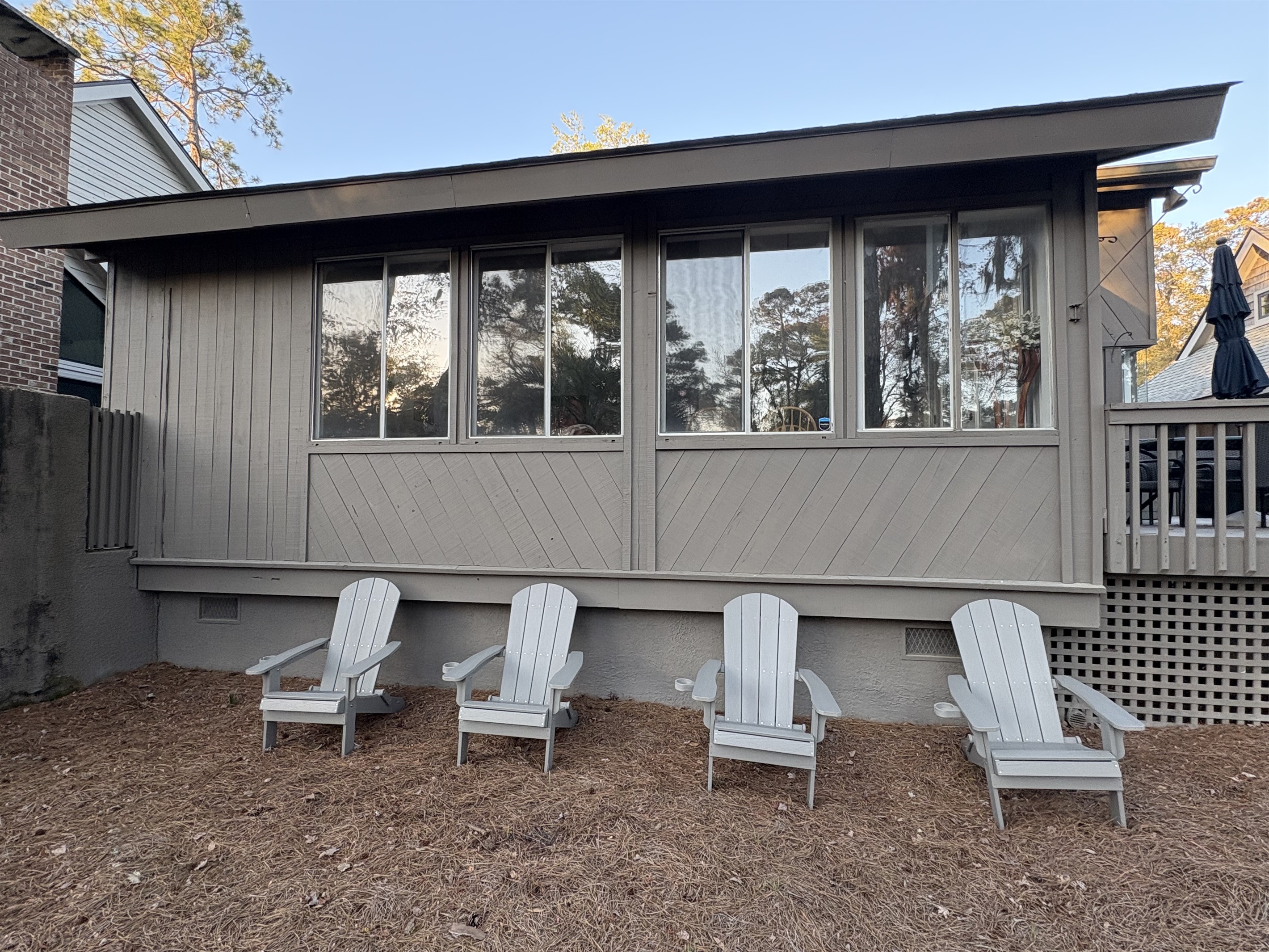 4 Adirondack Chairs in the backyard