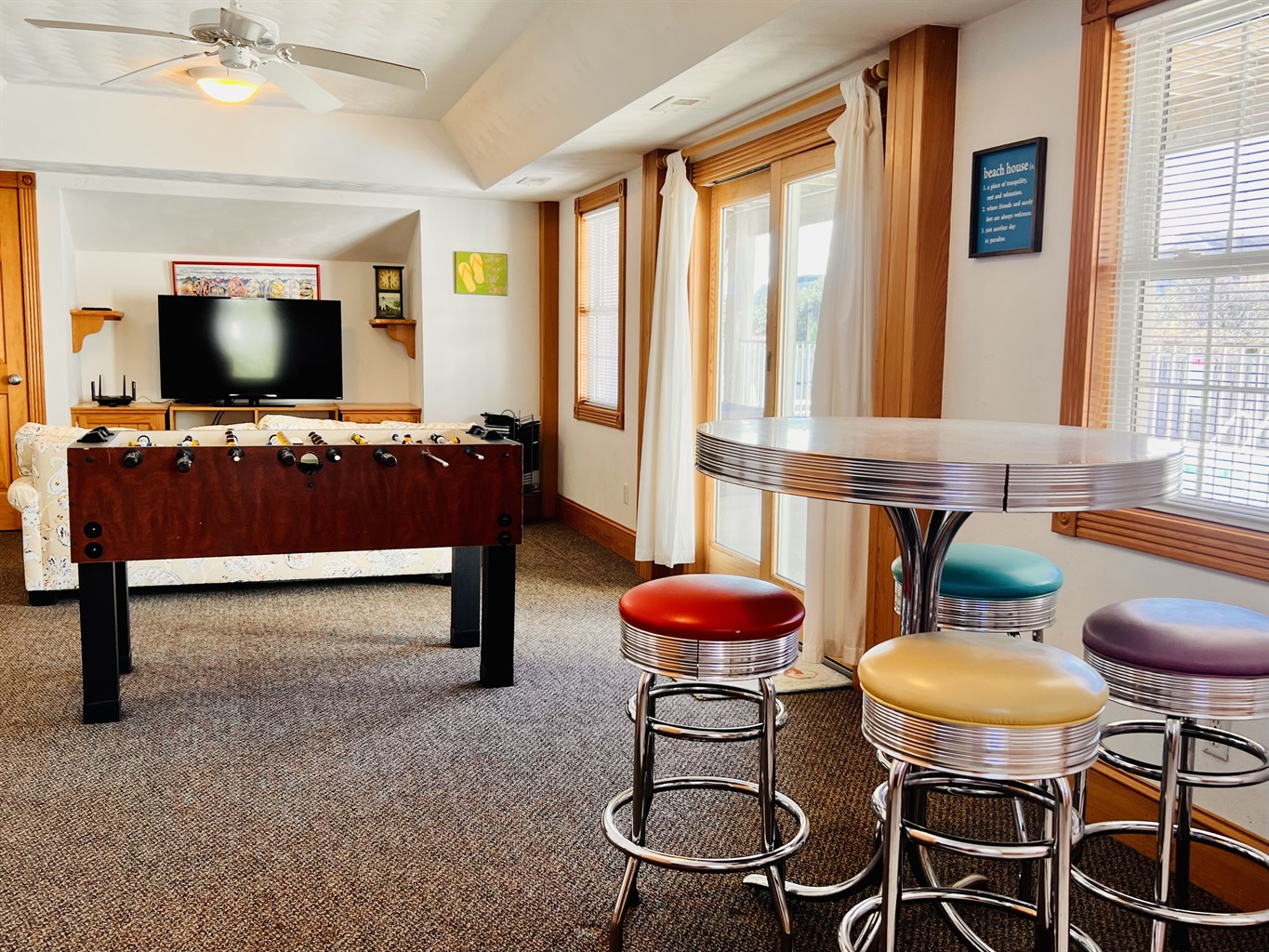 Game room, foosball table and retro sitting area.