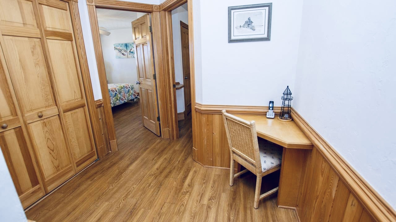 Corner nook with a chair and a small table.