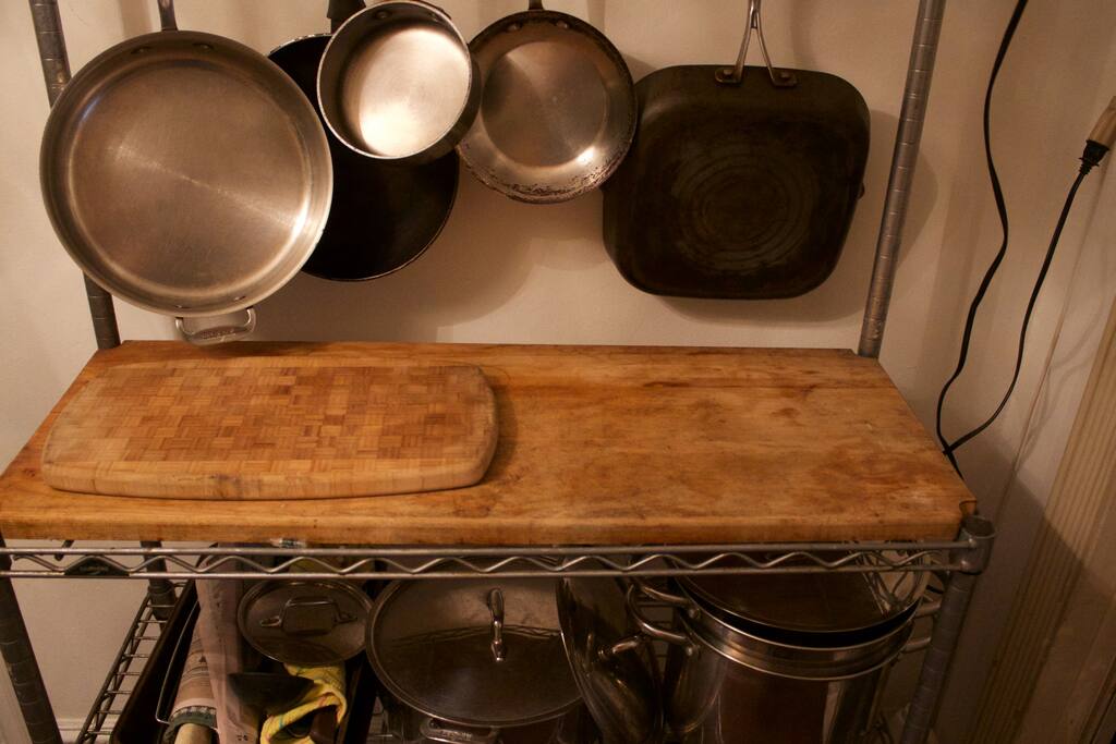 Cutting board and pots/pans rack. - UWS Bedroom In Luxury Building - New York