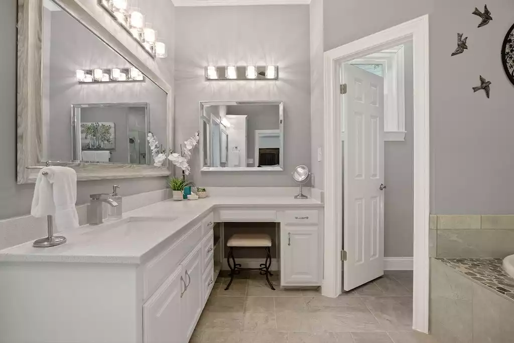 The first of the dual vanities with built-in makeup station. Bathroom #1. The first of the dual vanities with built-in makeup station. Bathroom #1. - Main House at Whispering Oaks Estate - Dripping Springs