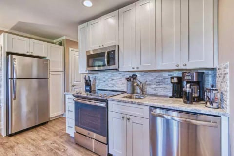 Fully equipped kitchen has all new cabinets, full-size stainless appliances, granite & marble!