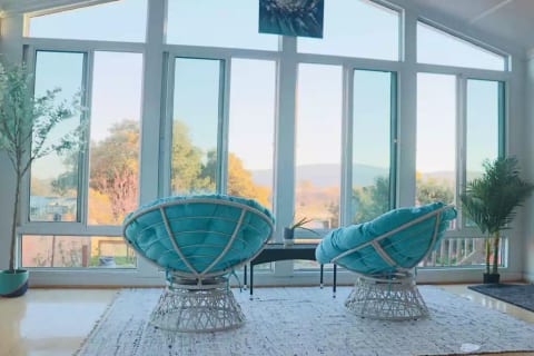 Relaxing Sun room with a view to the mountains and the garden.