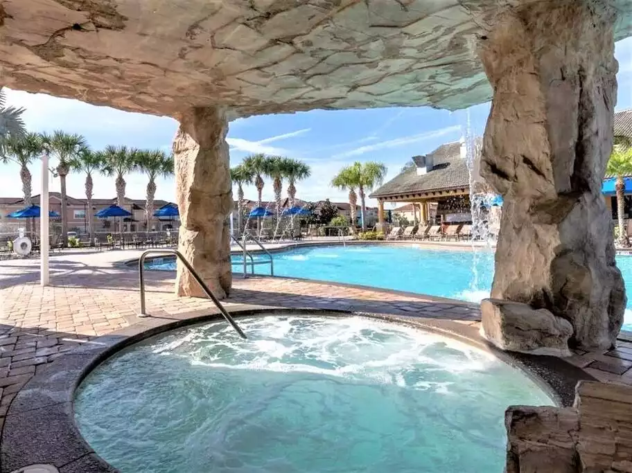 A shaded jacuzzi within the pool grotto - 5mi Disney* Immersive Themes* Outdoor Pool & Movie - Kissimmee