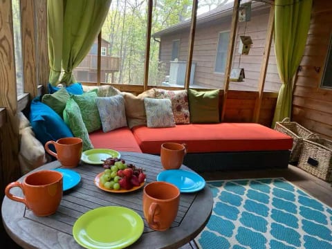 Enjoy some snacks in the sunroom with a great view of the outdoors.
Read a book, listen to sounds of rain, the sounds of birds or take in the wonderful view of nature.