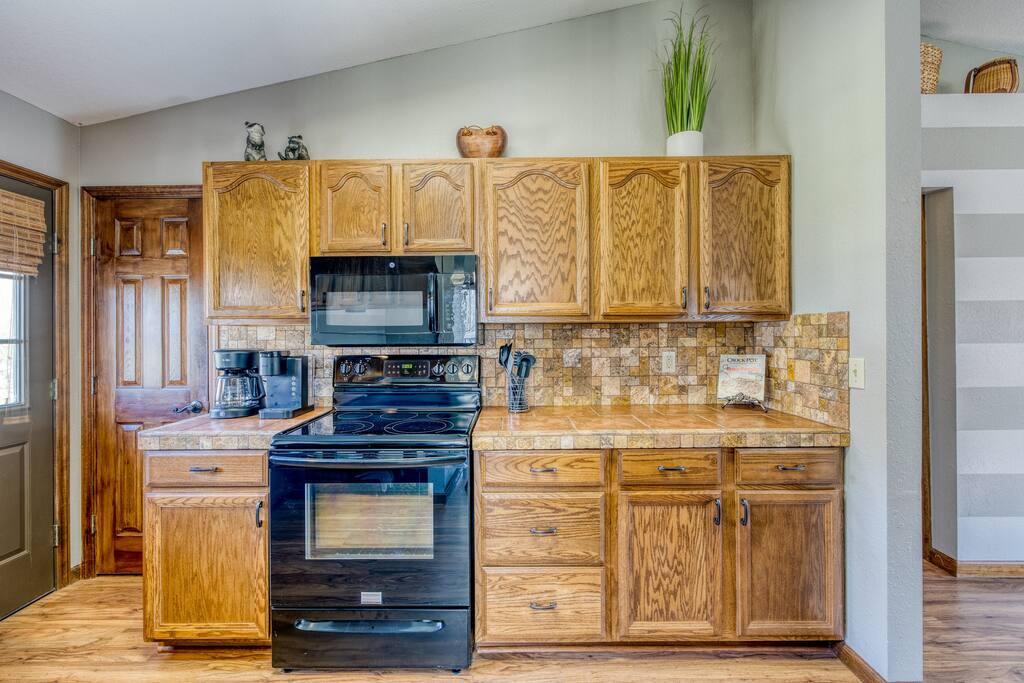 Kitchen | Stove | Marble, NC | Smoky Mountain Cabin | Riverbend Escape - Riverfront Escape | Hot Tub | Game Room | Casino - Marble