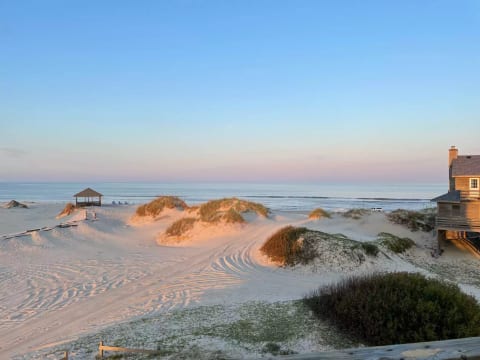 Dunes lit by sunset. Pic taken from back deck.