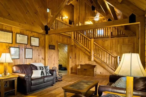 Main level living room with stairs to loft and 2nd floor bedrooms