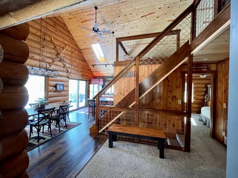 Spacious entry with view to kitchen and dining room beyond, vaulted loft and seating area. Skylights and new cusom kitchen beyond.