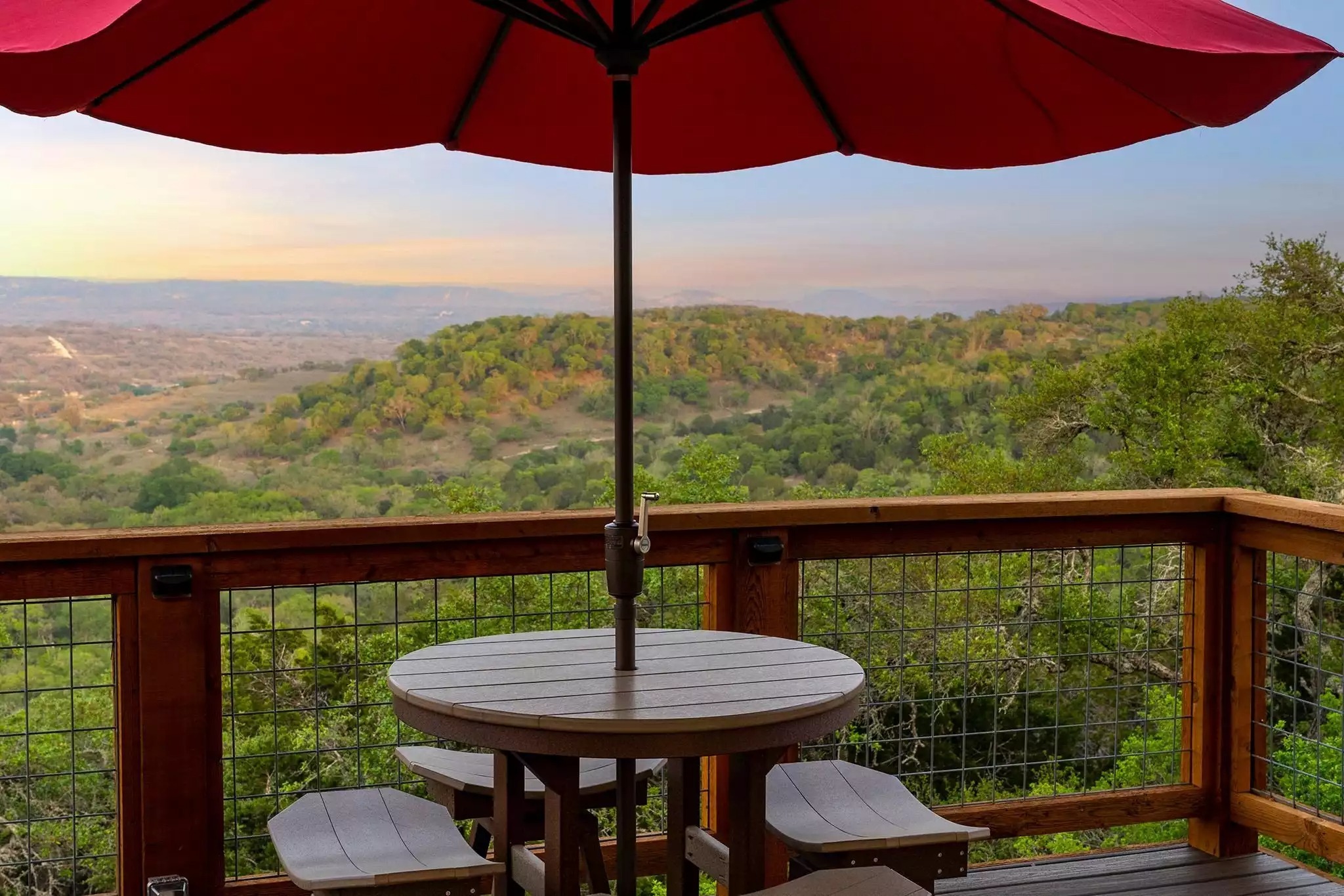 Table and stools looking onto the valley below. - GWR-Private-AmazingHilltopView-HotTub-FirePit-Pool - Fredericksburg