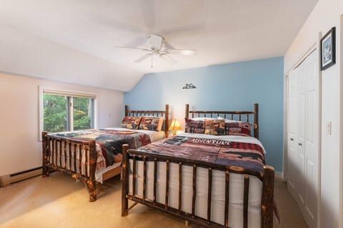 2 Queen log beds in the second bedroom on the second floor