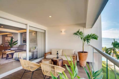 Large sliders make for a nice open flow from inside to the balcony.