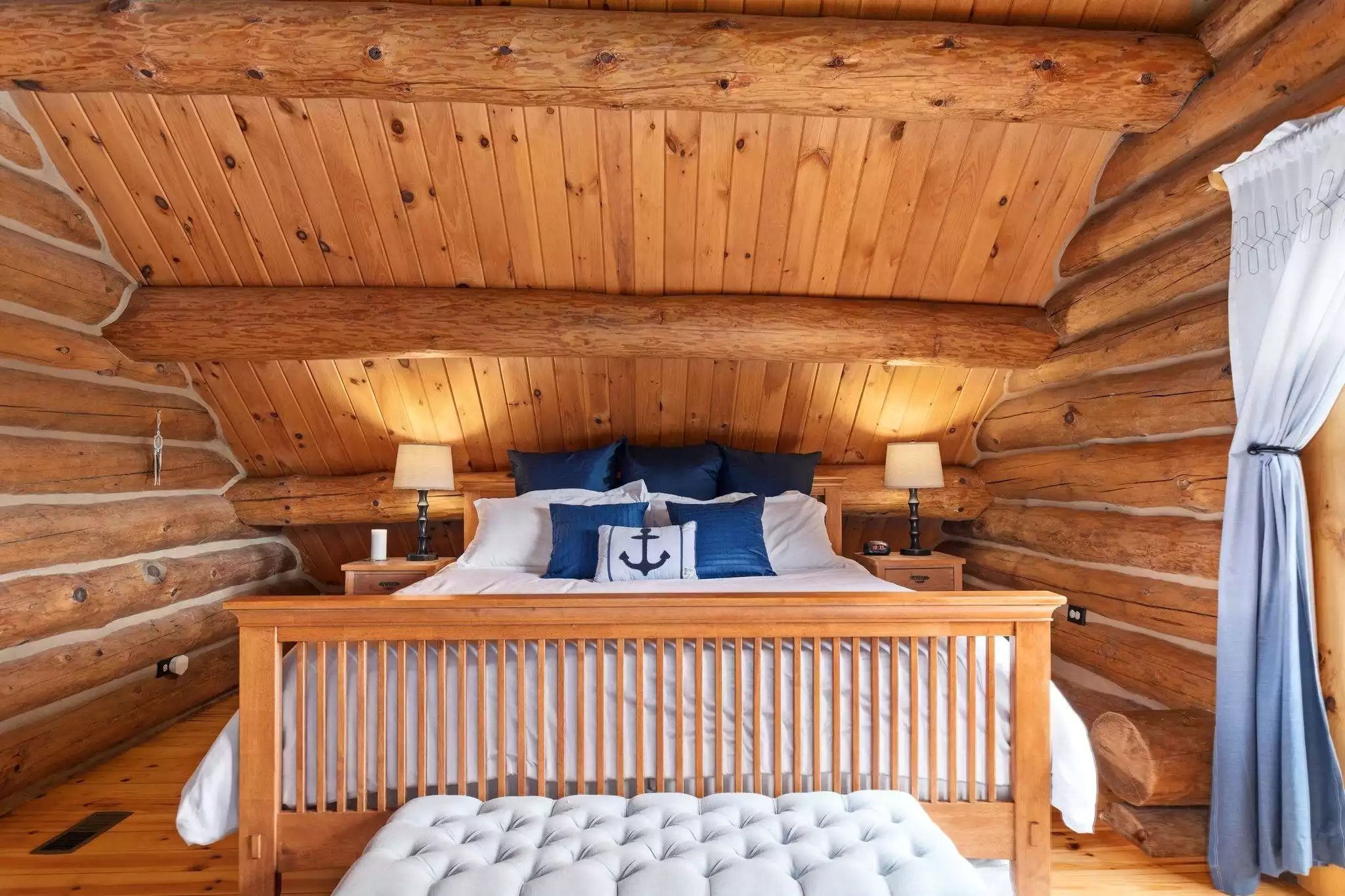 Primary bedroom with King bed - Kane Cabin Log Home w/beach on Baxter Lake, NH - Farmington