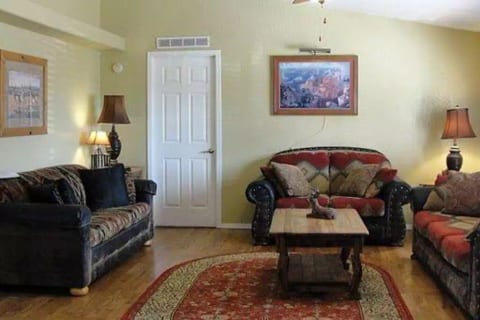 Large living room. Large screen tv wood and electric  fireplace