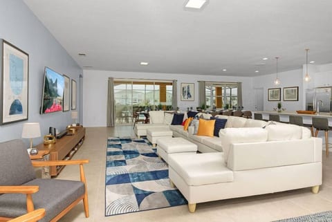 Huge Main Level Great Area with 70" $K Smart HDTV that opens to your private, screened swimming pool