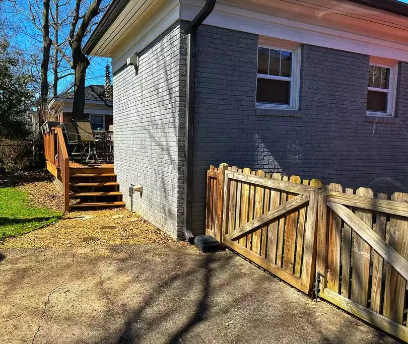 Steps leading up to back deck.  Gate/fence that runs across the top the driveway.  Backyard is fully fenced. - Four Miles to CNN, Aquarium, World of Coke, Georgia Dome, Georgia World Congress Center. - Atlanta