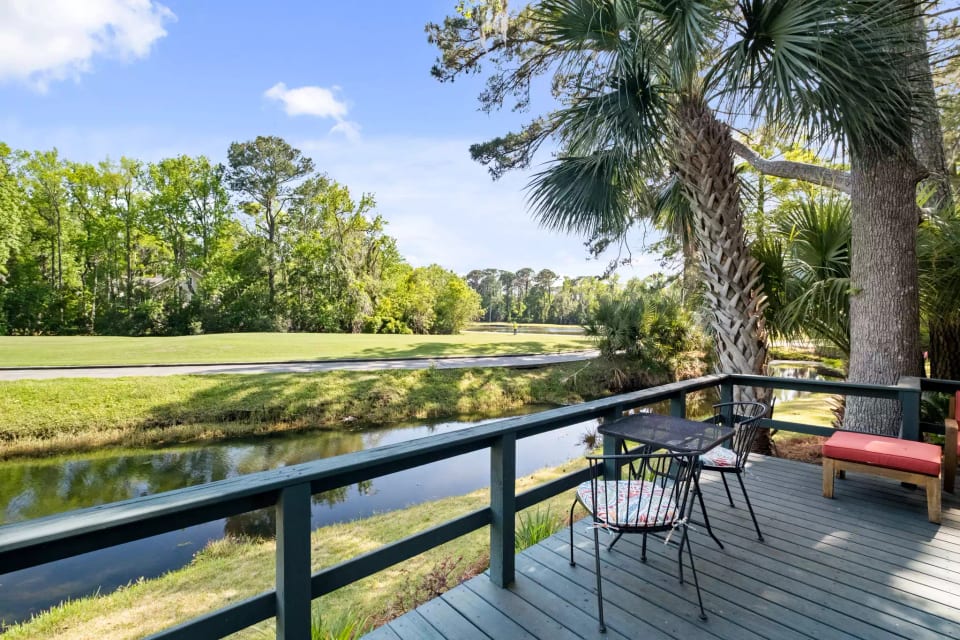 Back deck with lagoon and golf course view