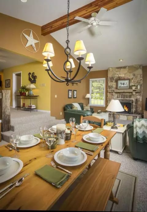 Dining room has seating for six with great outdoor views from wall of windows.