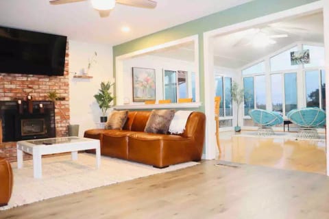 Relaxing Living room & Sun room with plenty of natural light and a view to the mountains.