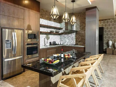 Gourmet kitchen complete with oven, microwave, wine bar, all utensils, etc.