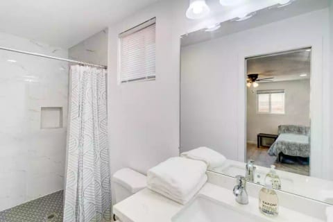 Full En Suite Bathroom with Large Stand Up Tiled Shower (No bathtub).