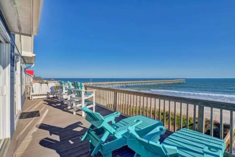Enjoy coffee, a coctail, a taco from across the street--whatever you're in the mood for--right here on the oceanfront deck. You might even spot a dolphin!