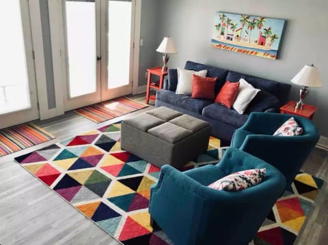 A colorful and comfortable living area to enjoy the beautiful water views.