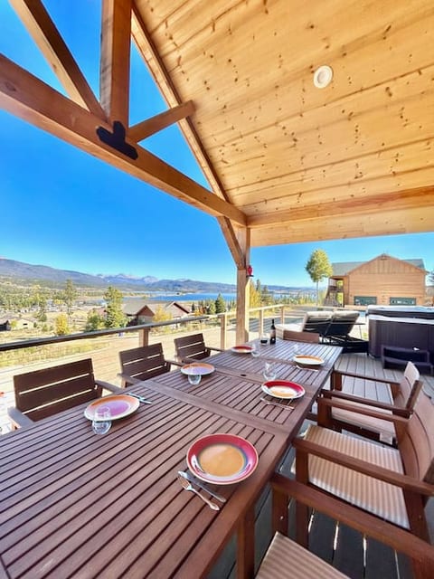 The expansive deck is the best place to relax and enjoy the beautiful views. The dining area features a large table with eight chairs. For bigger groups, you'll find 4 additional chairs in the closet in Primary Suite #2.