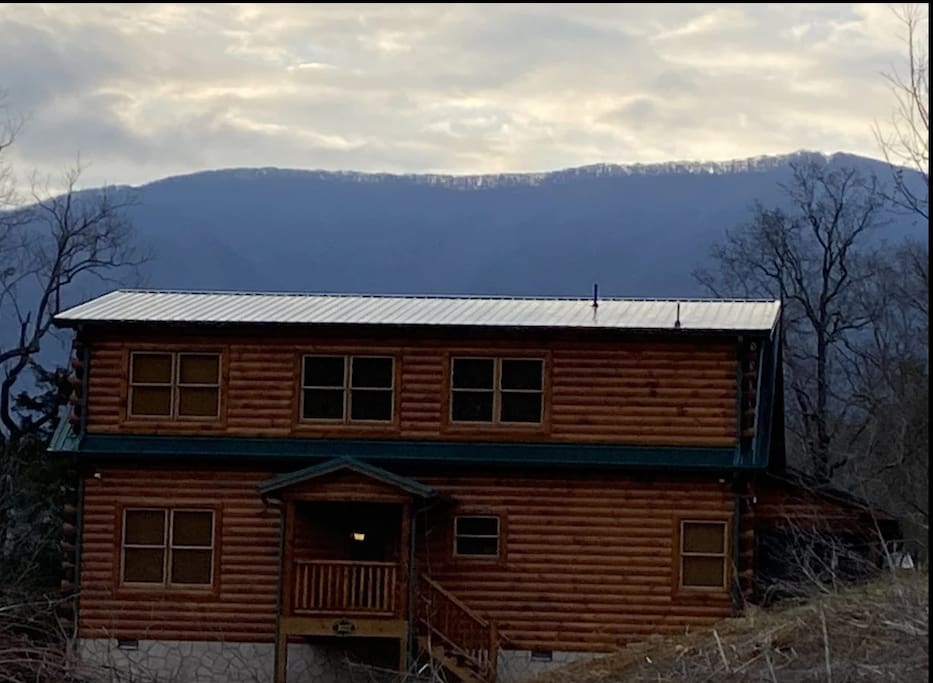 View of the Front of the Cabin with the mountain in the Background