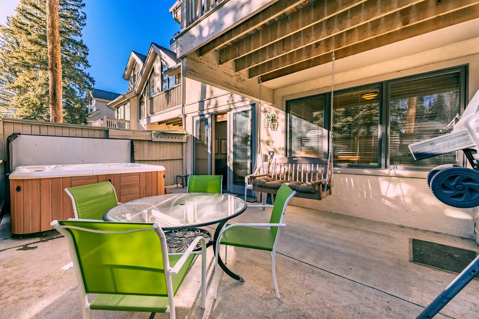 Private patio with hot tub and swing
