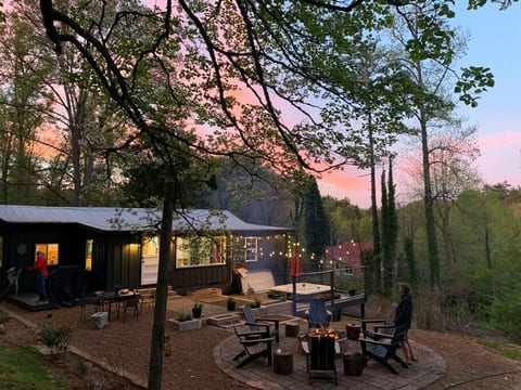 Sunset at the cabin. With fire pit, hot tub and grilling area that includes darts.