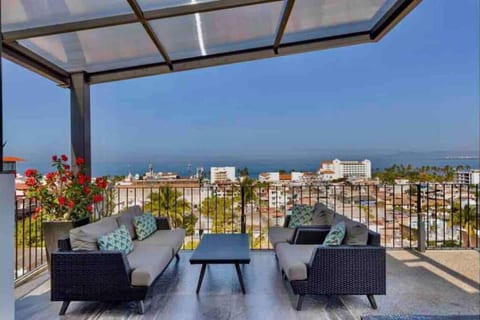 Shaded rooftop eating/lounging area.