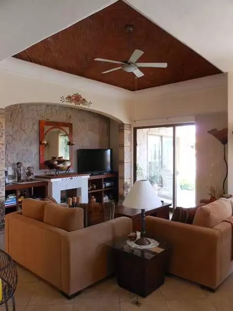 Full view of living room with domed ceiling, TV, DVD, surround sound, gas fp