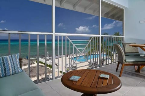 Relax and enjoy an afternoon nap on the comfortable sectional on the ocean-front balcony.